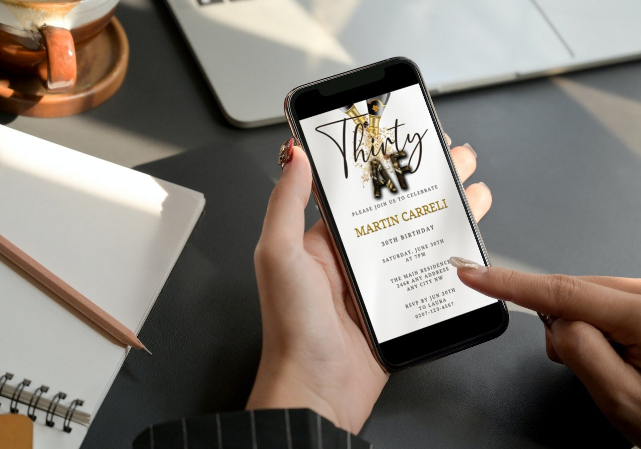 Person holding a phone displaying a customizable White Gold Champagne Thirty AF Party Evite template, ready for personalization and electronic sharing via text or email.