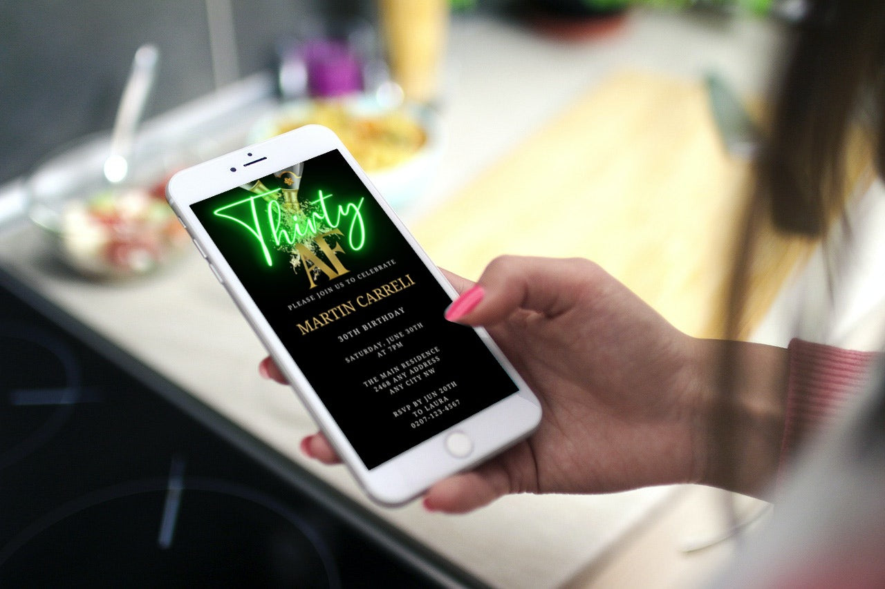 Hand holding a phone displaying a customizable Black Gold Champagne Neon Green Thirty AF Party Evite for smartphone, available for easy personalization using Canva.