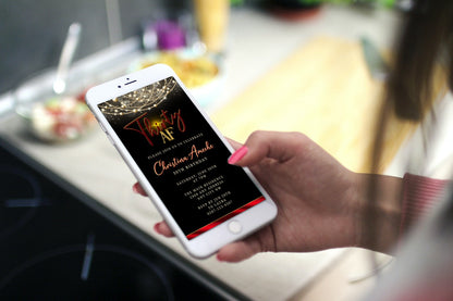 Hand holding a smartphone displaying a customizable Black Red Neon Art Deco Bling 30AF Birthday Evite.