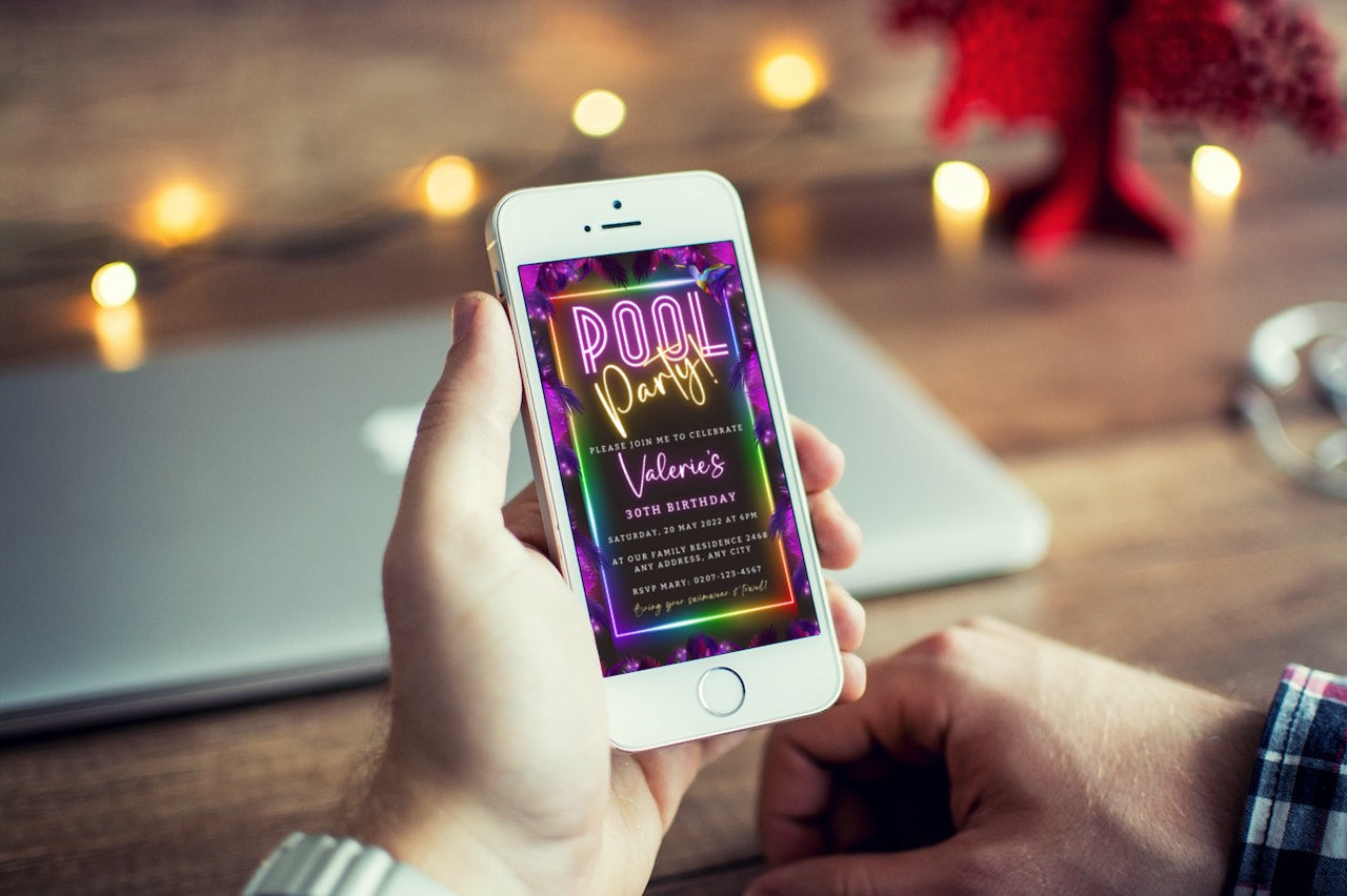 Person holding a smartphone displaying a customizable Tropical Neon Pool Party digital invitation template from URCordiallyInvited.