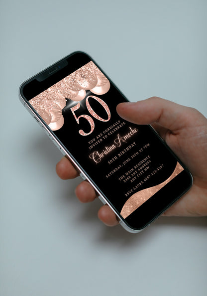 Hand holding a smartphone displaying a customisable Digital Rose Gold Balloons Glitter | 50th Birthday Evite template.