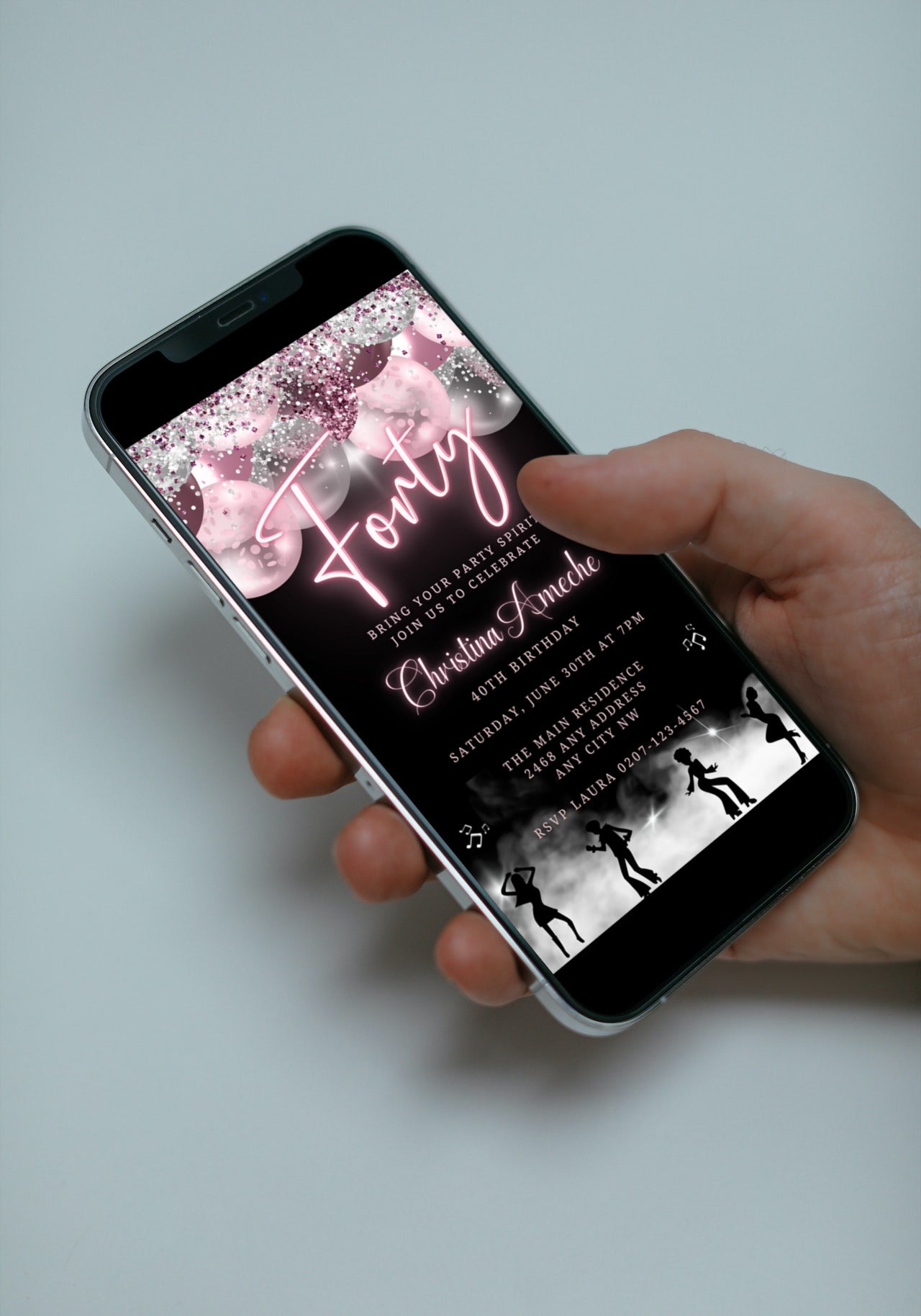 Hand holding a smartphone displaying a customizable Mauve Pink Silver Neon | 40AF Birthday Video Evite for easy personalization via Canva.