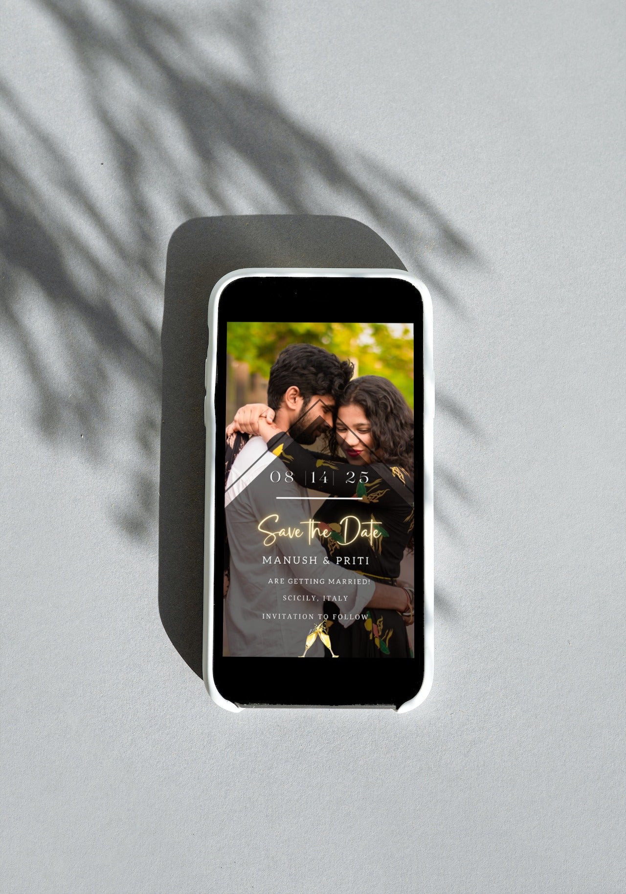 Gold Neon Photo Save The Date Wedding Evite displayed on a smartphone screen featuring a couple hugging.