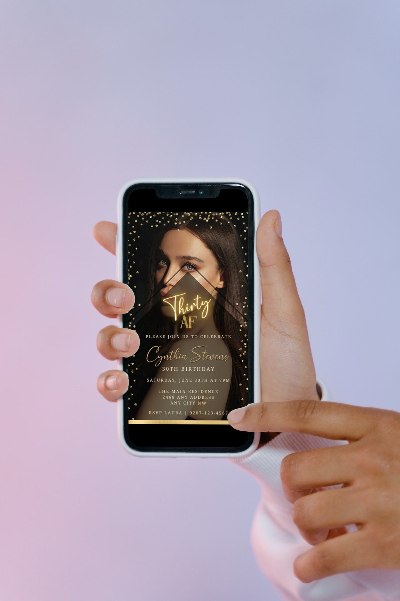 Hand holding a smartphone displaying a customizable Photo Background Gold | 30AF Birthday Evite digital invitation template from URCordiallyInvited.
