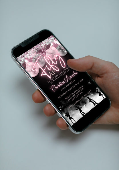 Hand holding a smartphone displaying a Mauve Pink Silver Neon 50AF Birthday Video Evite template for customization and electronic sharing via Canva.