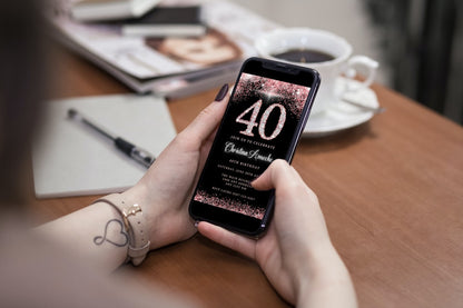 Person holding a smartphone displaying a customizable Rose Gold Glitter Diamond 40th Birthday Evite.