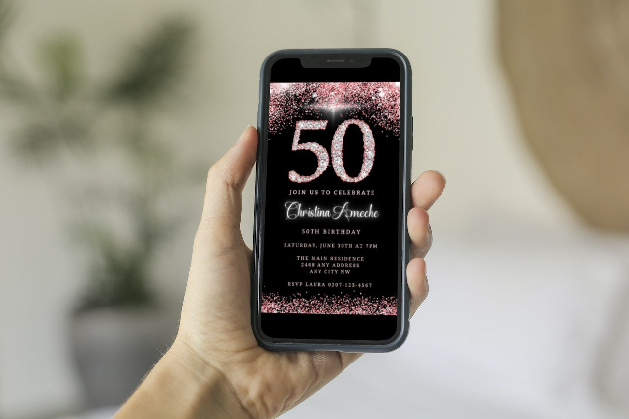 A hand holding a smartphone displaying a customizable Rose Gold Diamond Glitter 50th Birthday Evite template for easy personalization and electronic sharing.