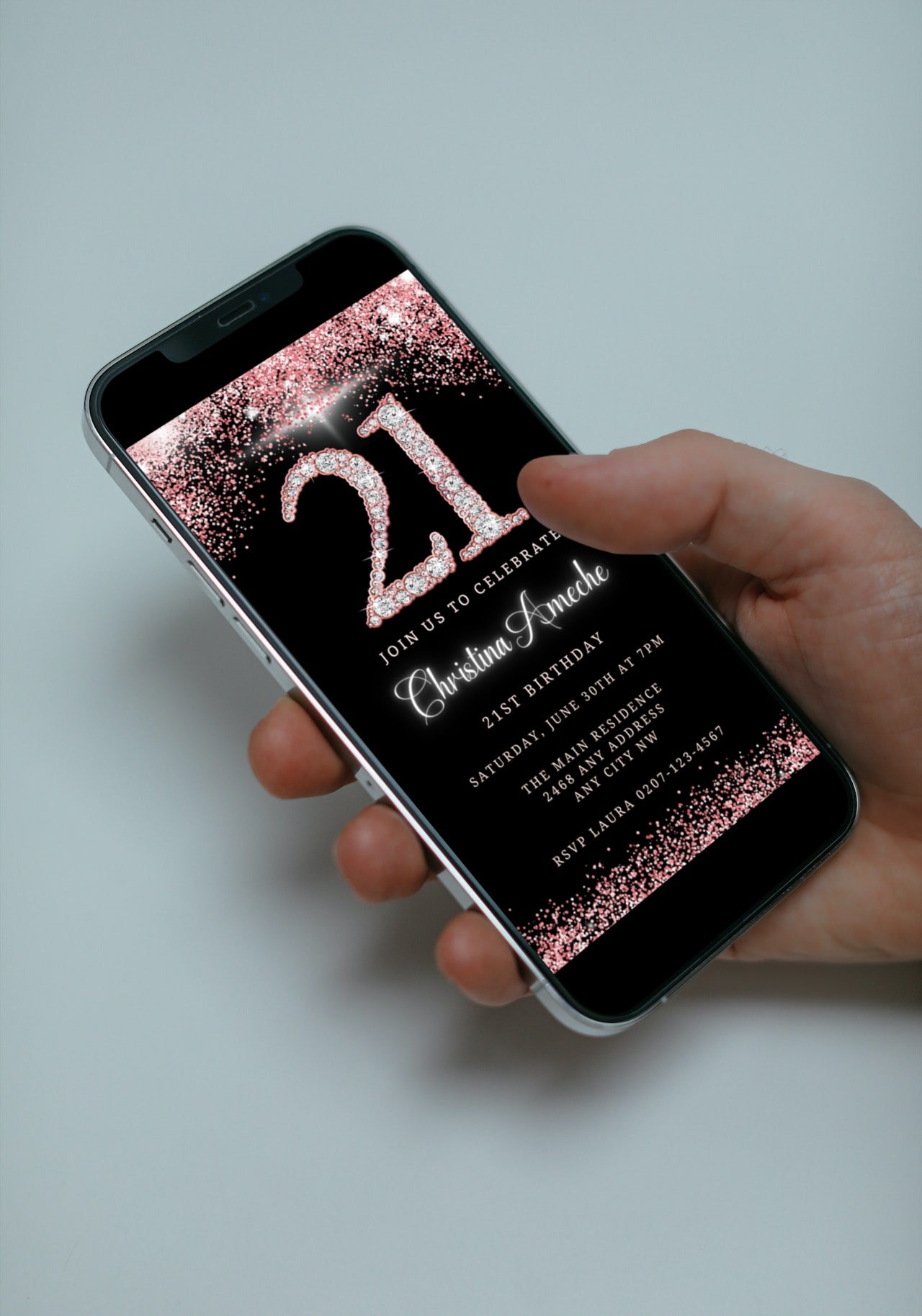 Hand holding a smartphone displaying the customisable Digital Rose Gold Glitter Diamond 21st Birthday Evite from URCordiallyInvited.
