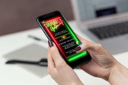 Person holding a smartphone displaying a customizable Jamaica Girl's Getaway party video invitation template.