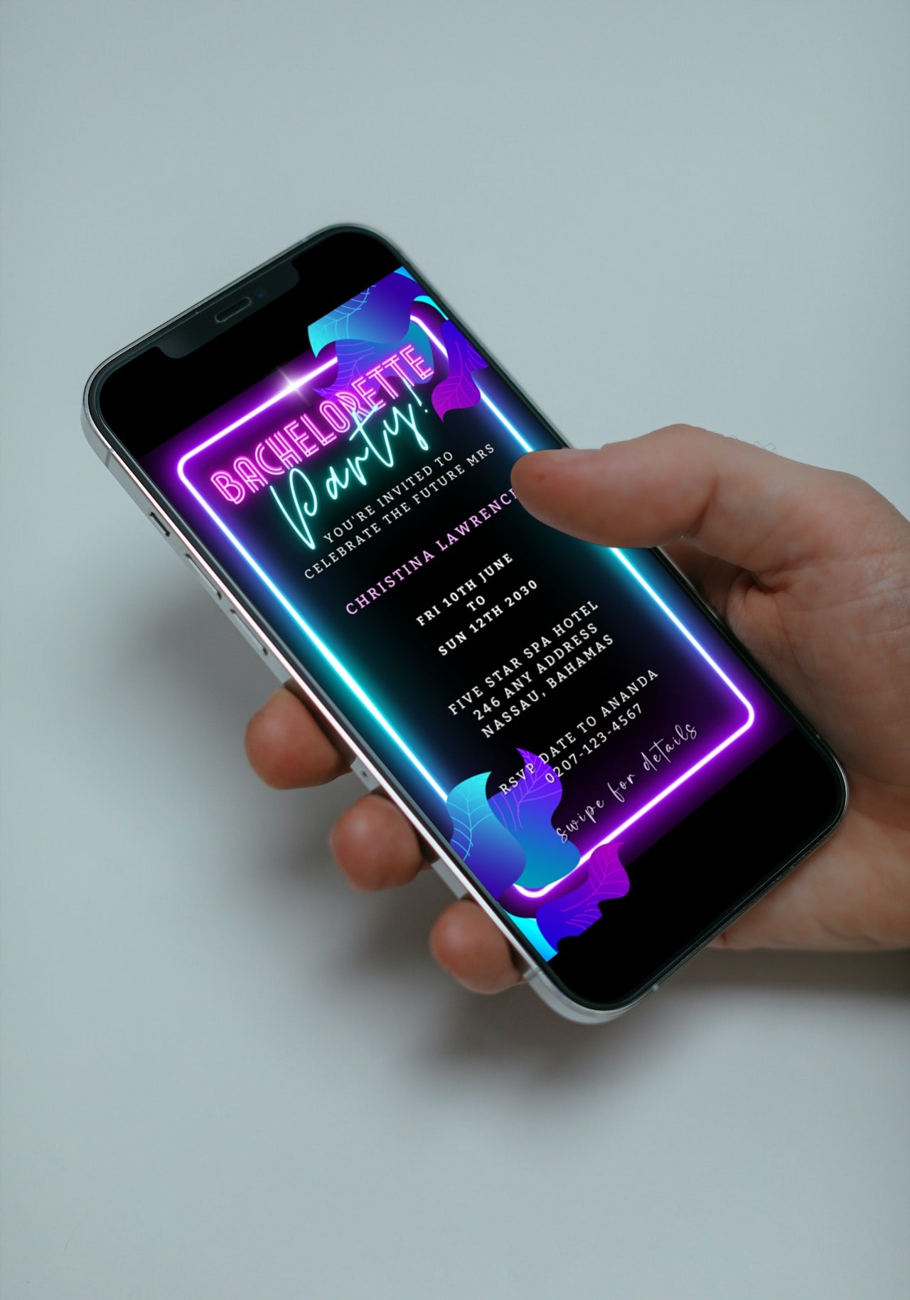 Hand holding a smartphone displaying a customizable digital invitation template for a Neon Pink Aqua Black Bachelorette Getaway Party Evite.