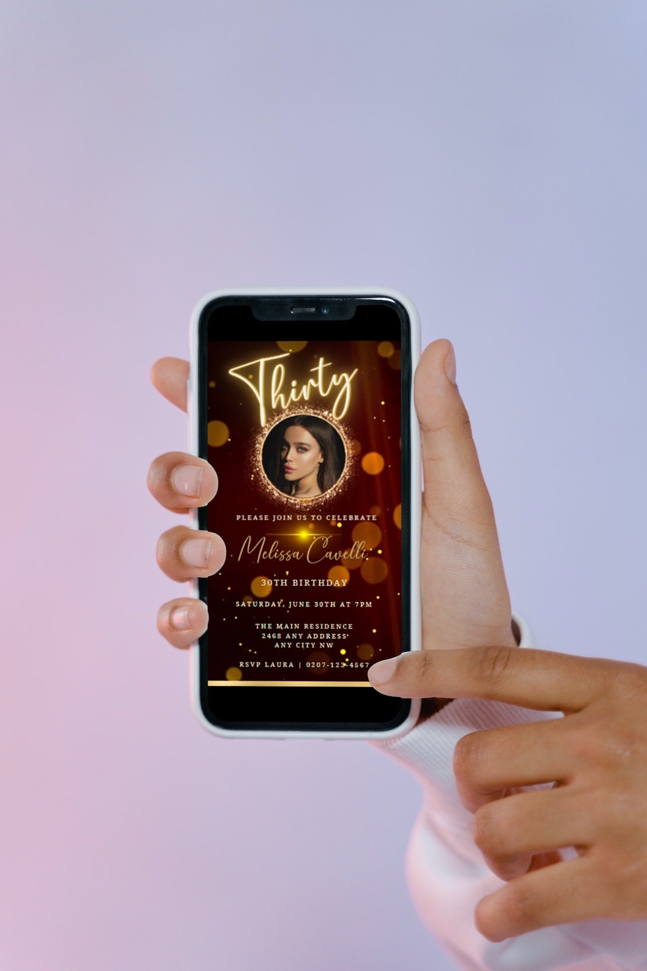 A hand holding a smartphone displaying a customizable 30th Birthday Video Invite with a picture of a woman on the screen.