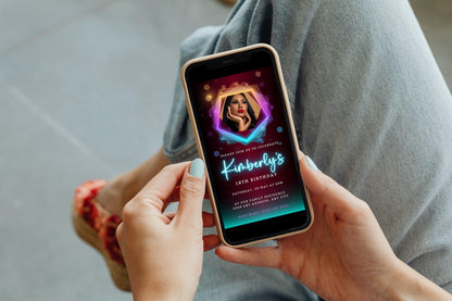 Person holding a phone displaying a customizable digital Birthday Party Evite template, Neon Maroon Teal with Photo, for editing and sharing via smartphone.