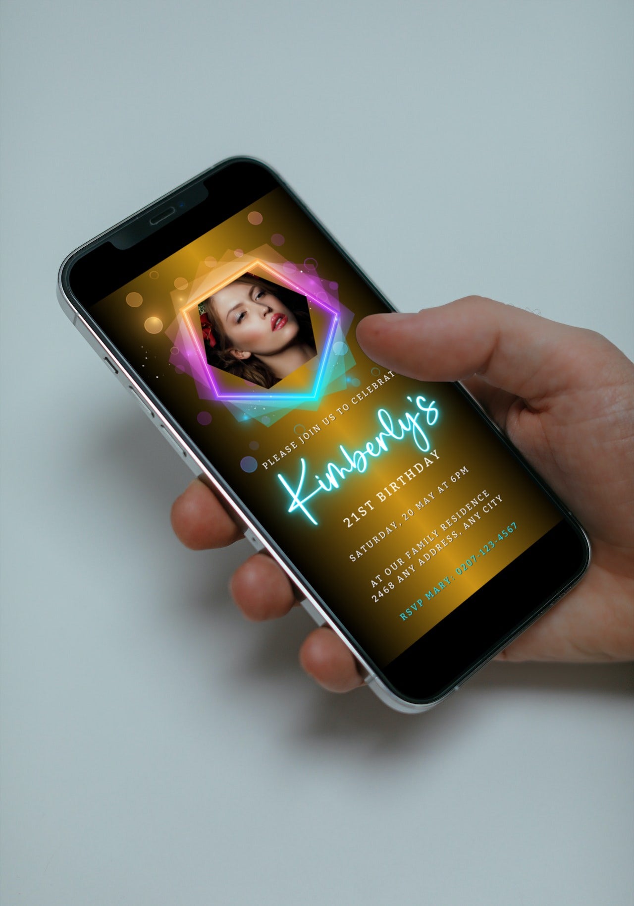 Hand holding a smartphone displaying a customizable Gold Pink Teal Neon Birthday Party Evite.