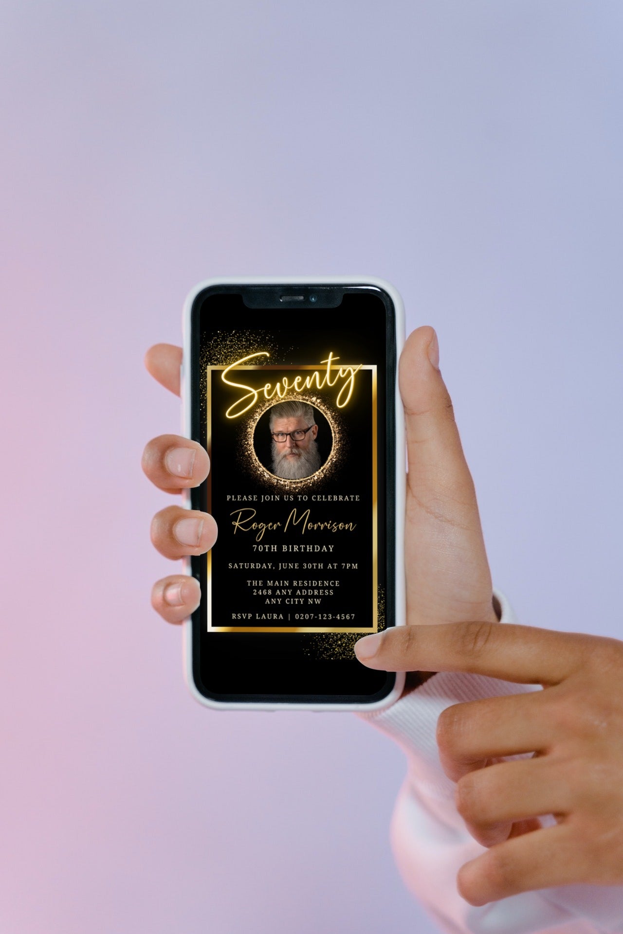 Hand holding a phone displaying a man's photo, promoting the customisable Neon Gold Oval Photo Frame | 70th Birthday Evite from URCordiallyInvited.