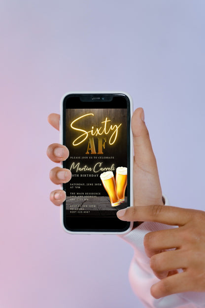 Hand holding a smartphone displaying the customizable Black Gold Neon Beer | 60AF Birthday Evite invitation template from URCordiallyInvited.