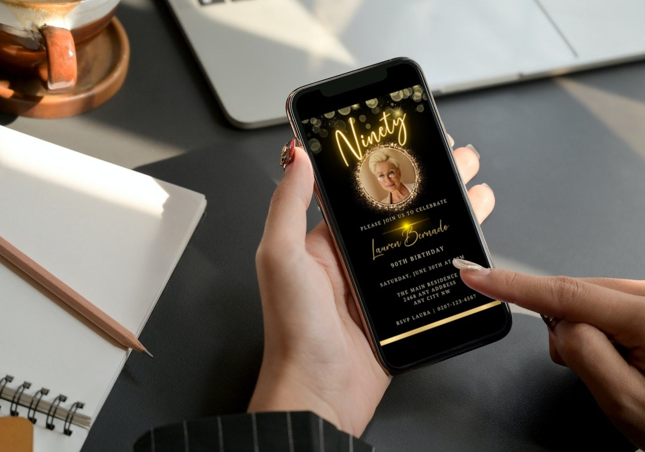 Person holding a smartphone displaying the customizable Gold Neon W/Oval Photo Frame | 90th Birthday Evite template for digital invitations.