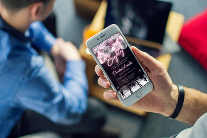 Person holding a smartphone displaying a customizable Mauve Pink Silver Neon | 80AF Birthday Evite from URCordiallyInvited.