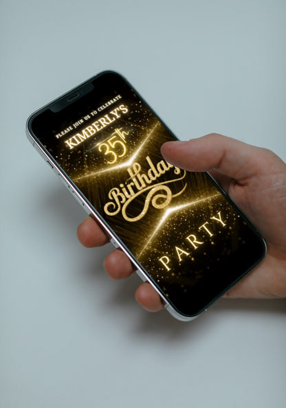 Hand holding a smartphone displaying a customizable Black Gold Glitter Any Age Birthday Video Invitation from URCordiallyInvited.