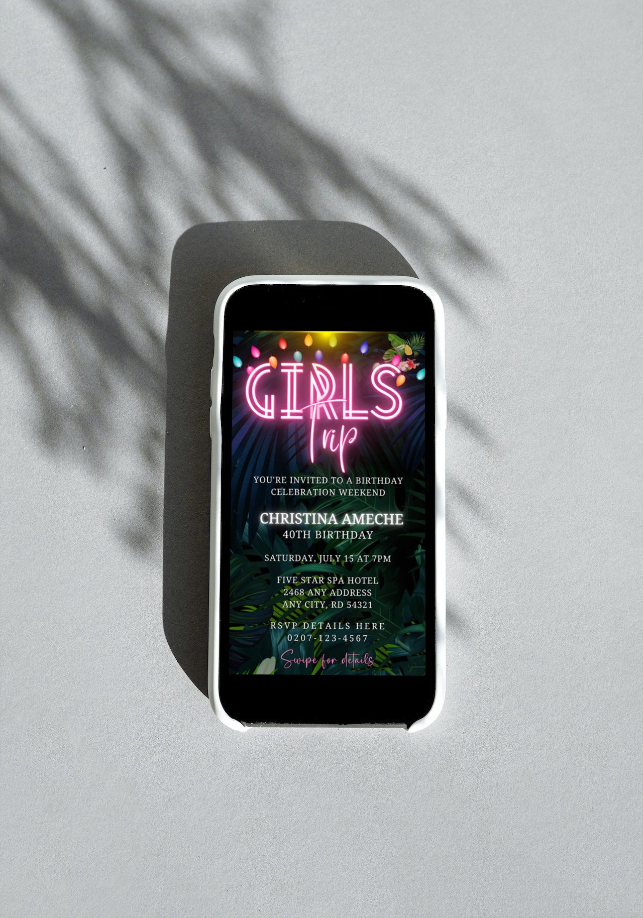 Digital invitation displayed on a smartphone, featuring a pink neon sign for a Tropical Destination Neon Pink | Girl's Trip Evite.