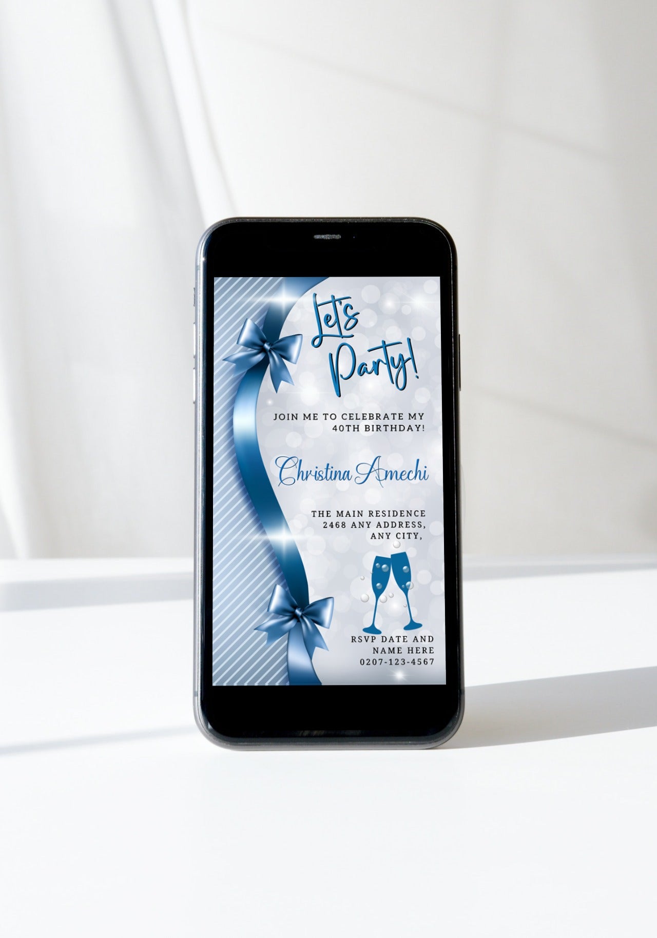 Blue Silver Bow Sparkle | Editable Birthday Evite displayed on a smartphone, featuring a blue ribbon and customizable text for personalizing invitations via Canva.