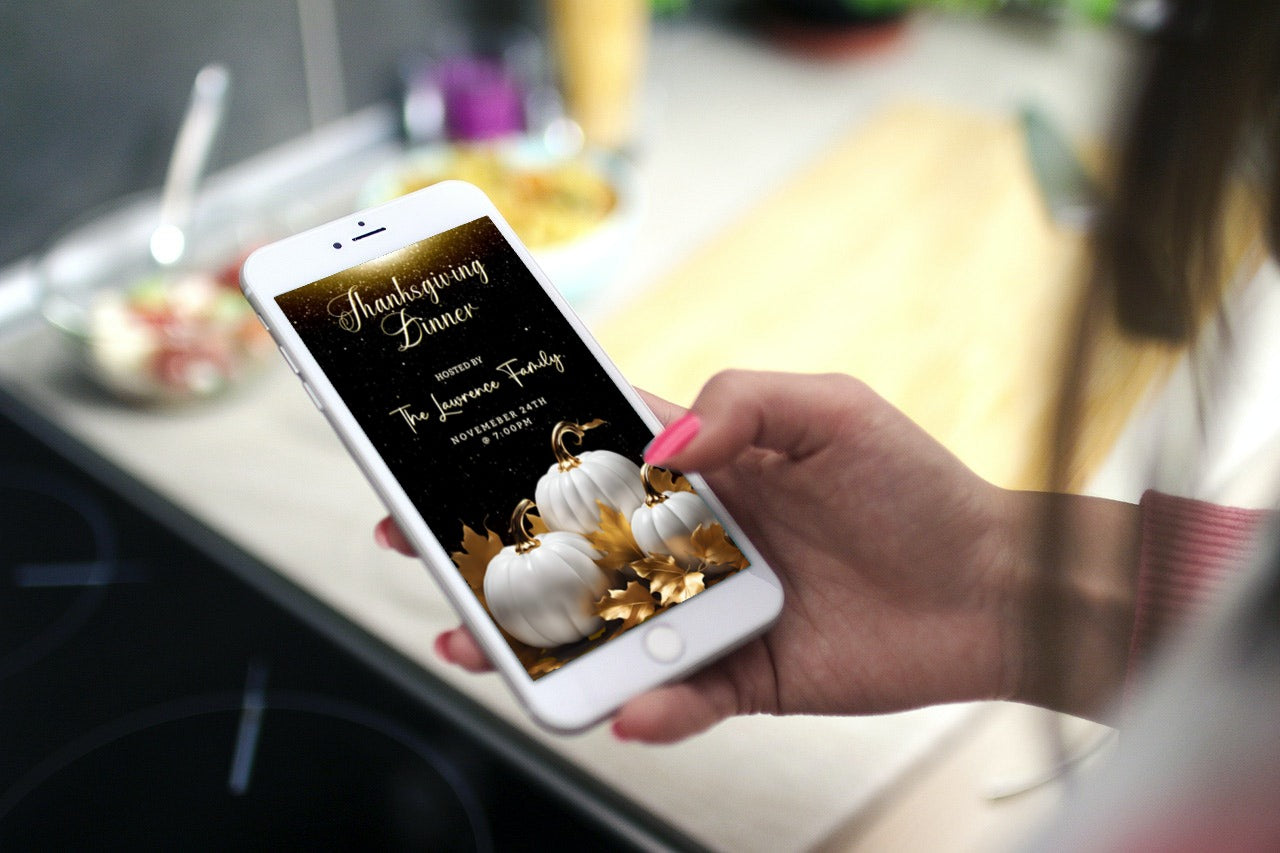 Hand holding a cell phone displaying a customizable Gold Glitter Neon White Pumpkins Thanksgiving Dinner Video Invite from URCordiallyInvited.