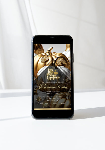 Cell phone displaying a Gold Neon White Pumpkin Thanksgiving Dinner Video Invite template on screen.