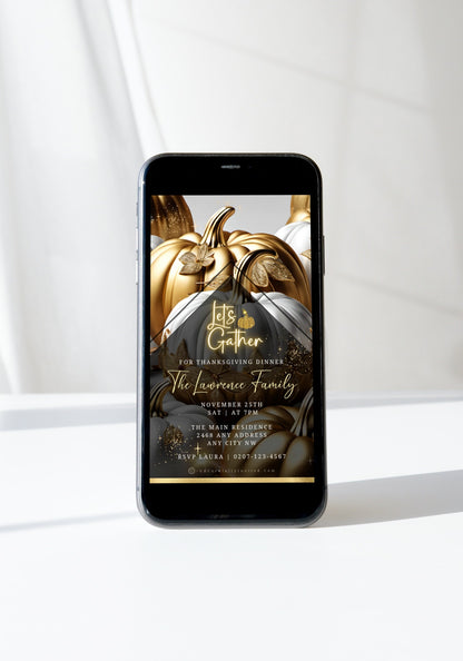 Smartphone displaying Gold Neon White Pumpkin Thanksgiving Dinner Video Invite with elegant script and pumpkin artwork, emphasizing sophisticated digital invitation customization through URCordiallyInvited.