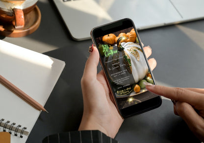 Person holding smartphone displaying White Fruitful Platter Glitter Pumpkin Thanksgiving Dinner Video Invite template on screen.