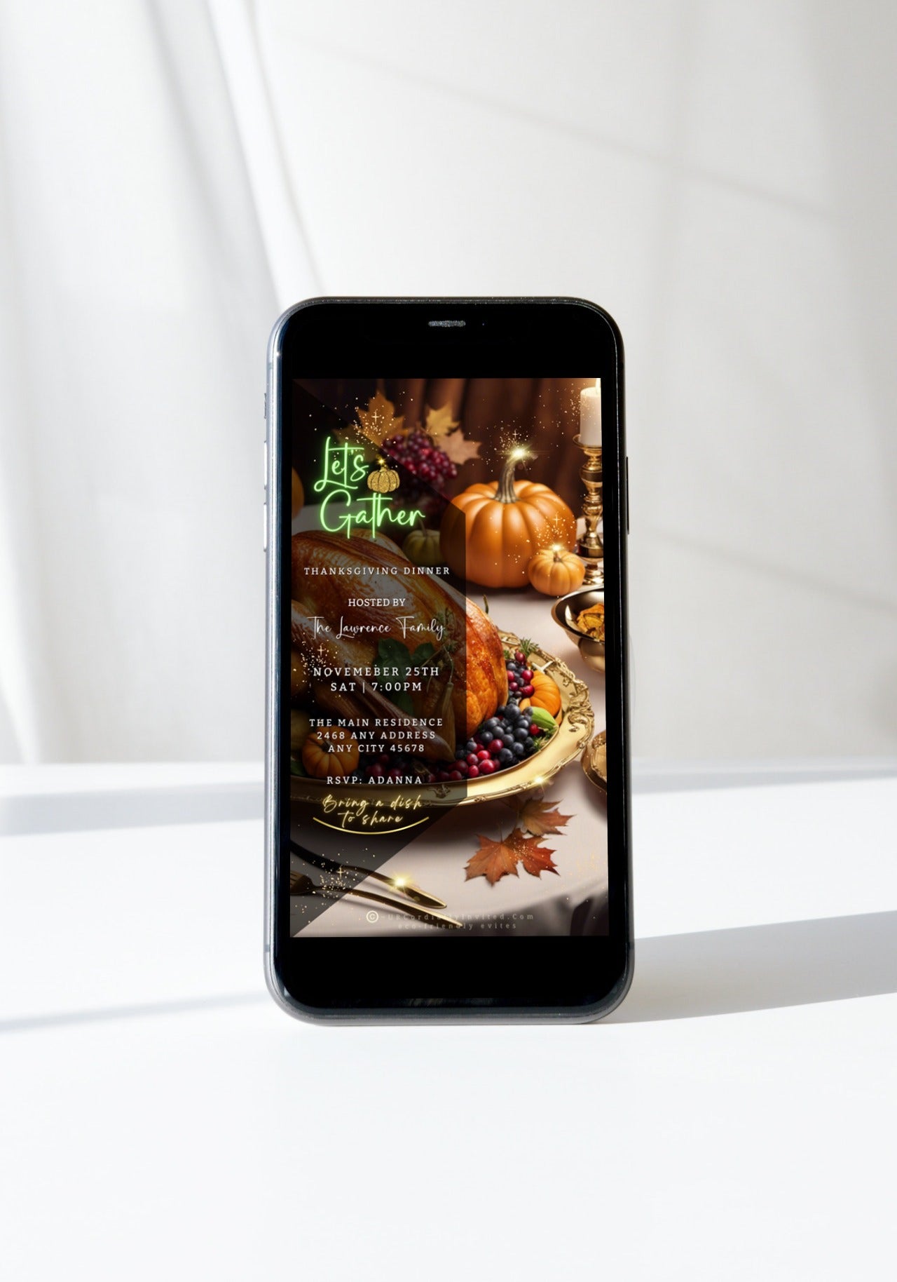 Modern smartphone displays Gold Fruitful Platter Pumpkins Thanksgiving Dinner Video Invite with autumnal design, hosted by The Lawrence Family, inviting guests to RSVP and bring a dish.
