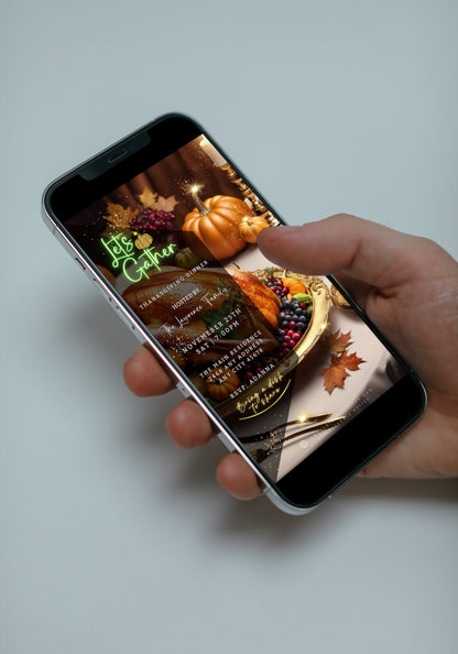 Hand holding a smartphone displaying a Gold Fruitful Platter Pumpkins | Thanksgiving Dinner Video Invite template with a picture of a turkey and fruit.