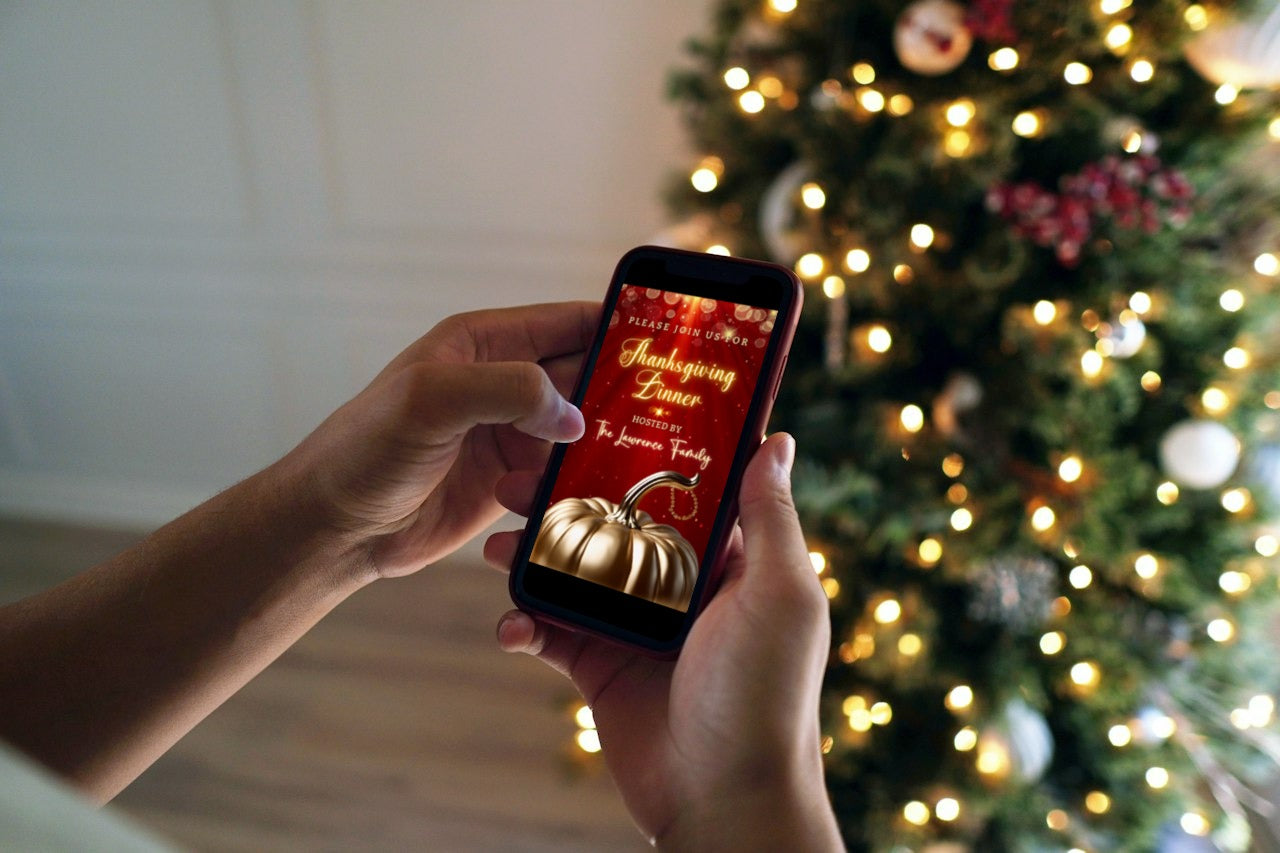 Person holding a phone showcasing the Red Gold Pumpkin Glitter Thanksgiving Dinner Video Invite template with a Christmas tree in the background.