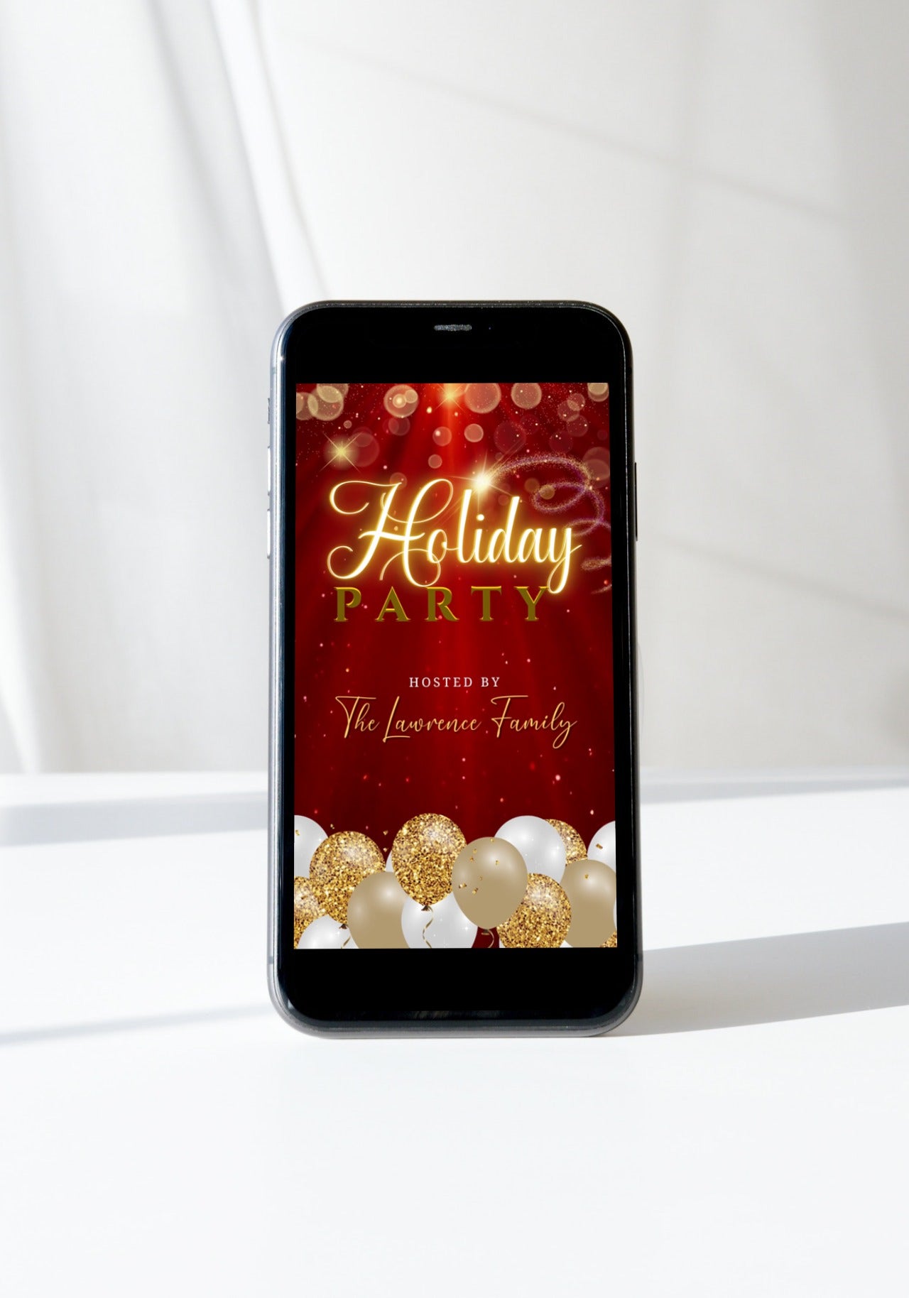 Cell phone displaying Red Gold Glitter Balloons Sparkle | Christmas Video Invitation template with red and gold festive background and balloons.