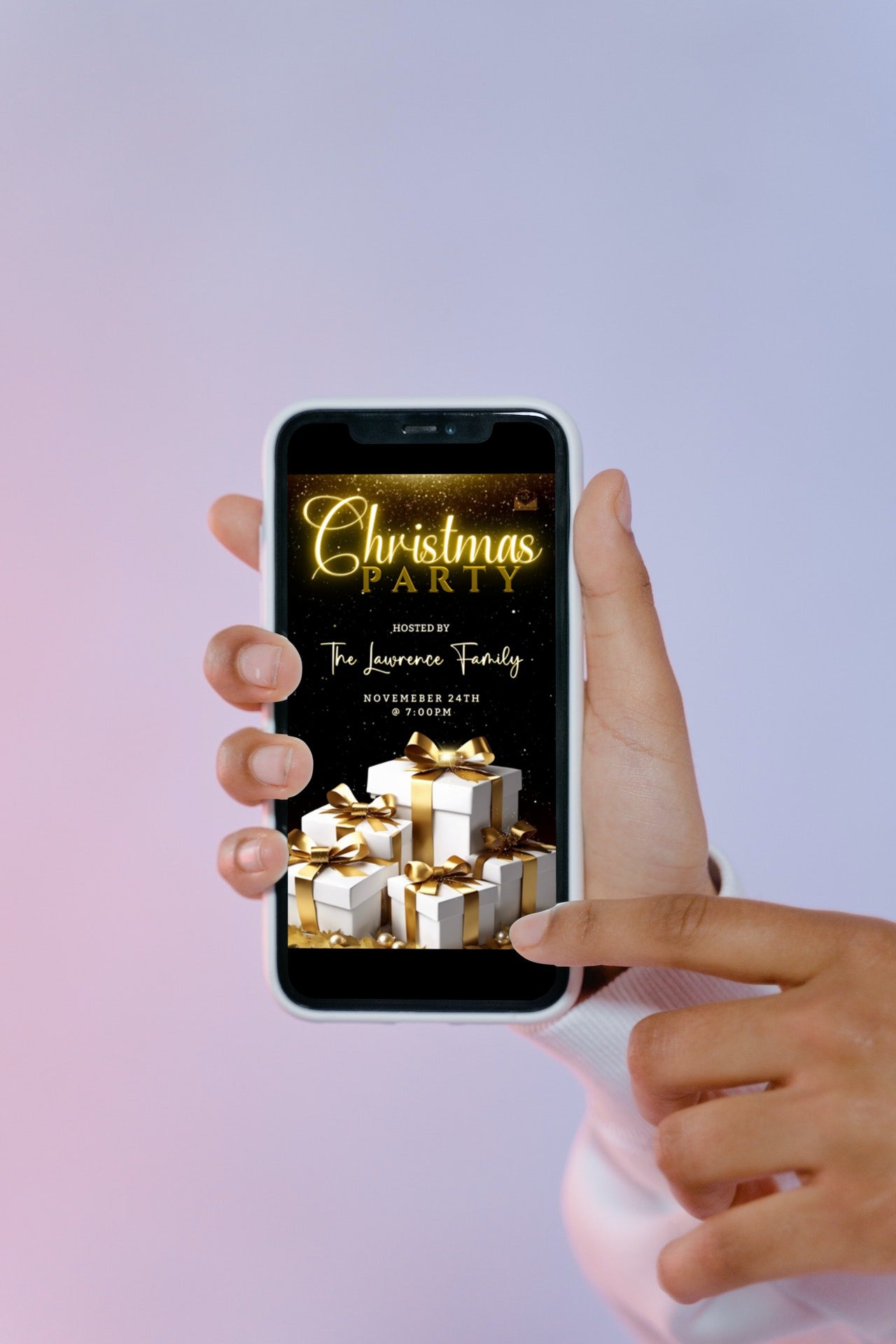 A hand holding a smartphone displaying a White Gold Leaves & Presents Christmas Video Invitation template.