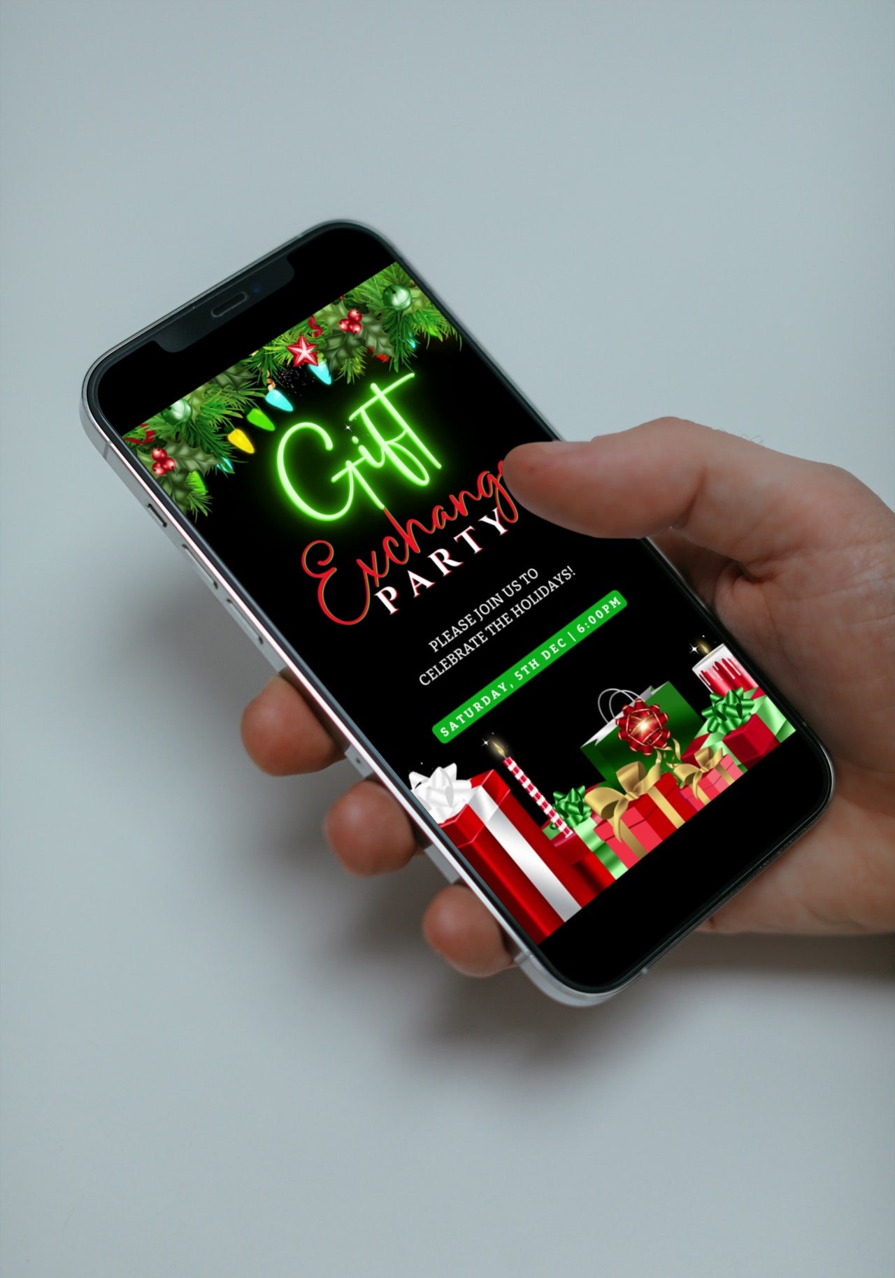 Hand holding a smartphone displaying a customizable, digital video invitation for a Colourful Lights Presents & Ornaments Gift Exchange Party.