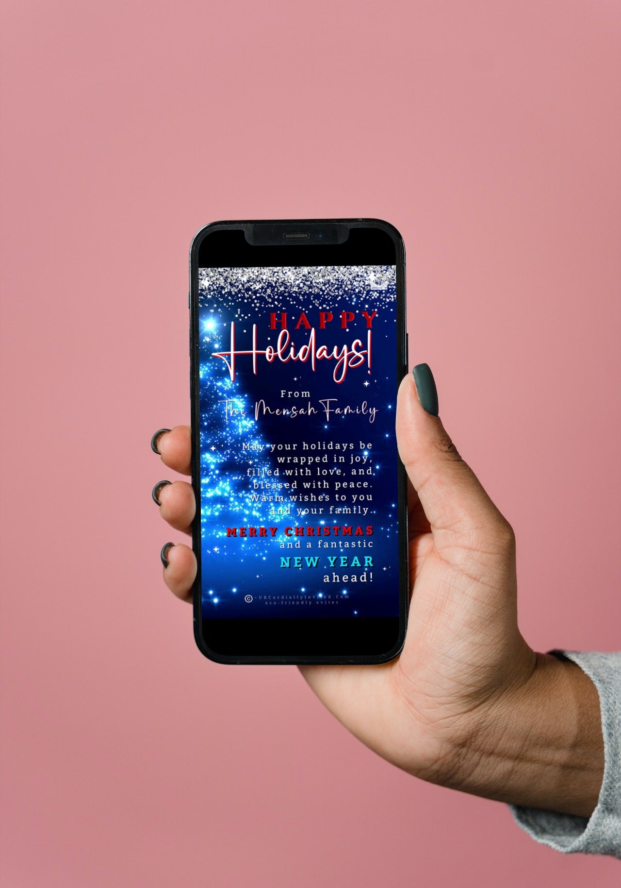 Hand holding a smartphone displaying the Blue Crystal Silver | Happy Holidays Video Greeting Ecard, customizable via Canva for digital invitations.