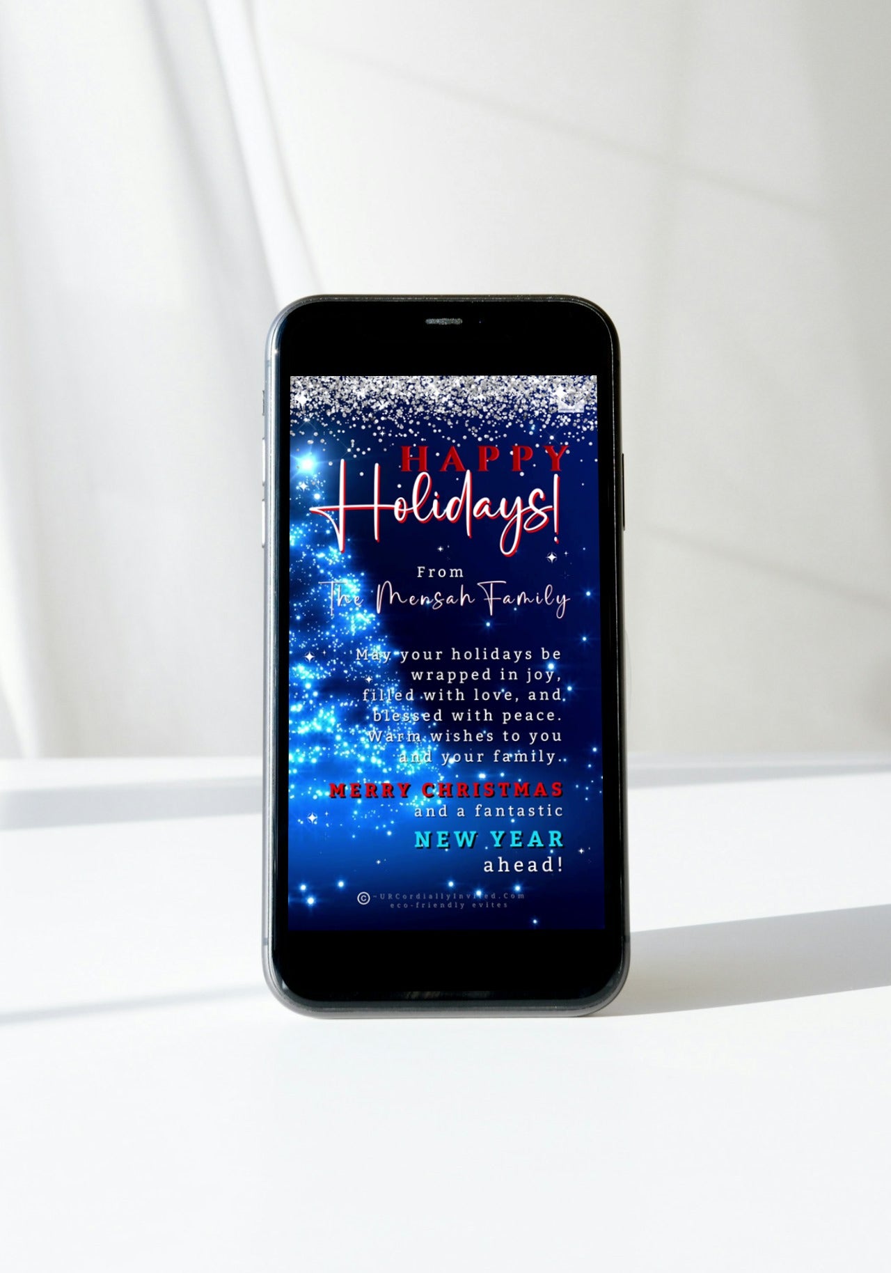 Smartphone displaying the Blue Crystal Silver | Happy Holidays Video Greeting Ecard template, ready for personalized editing via Canva.