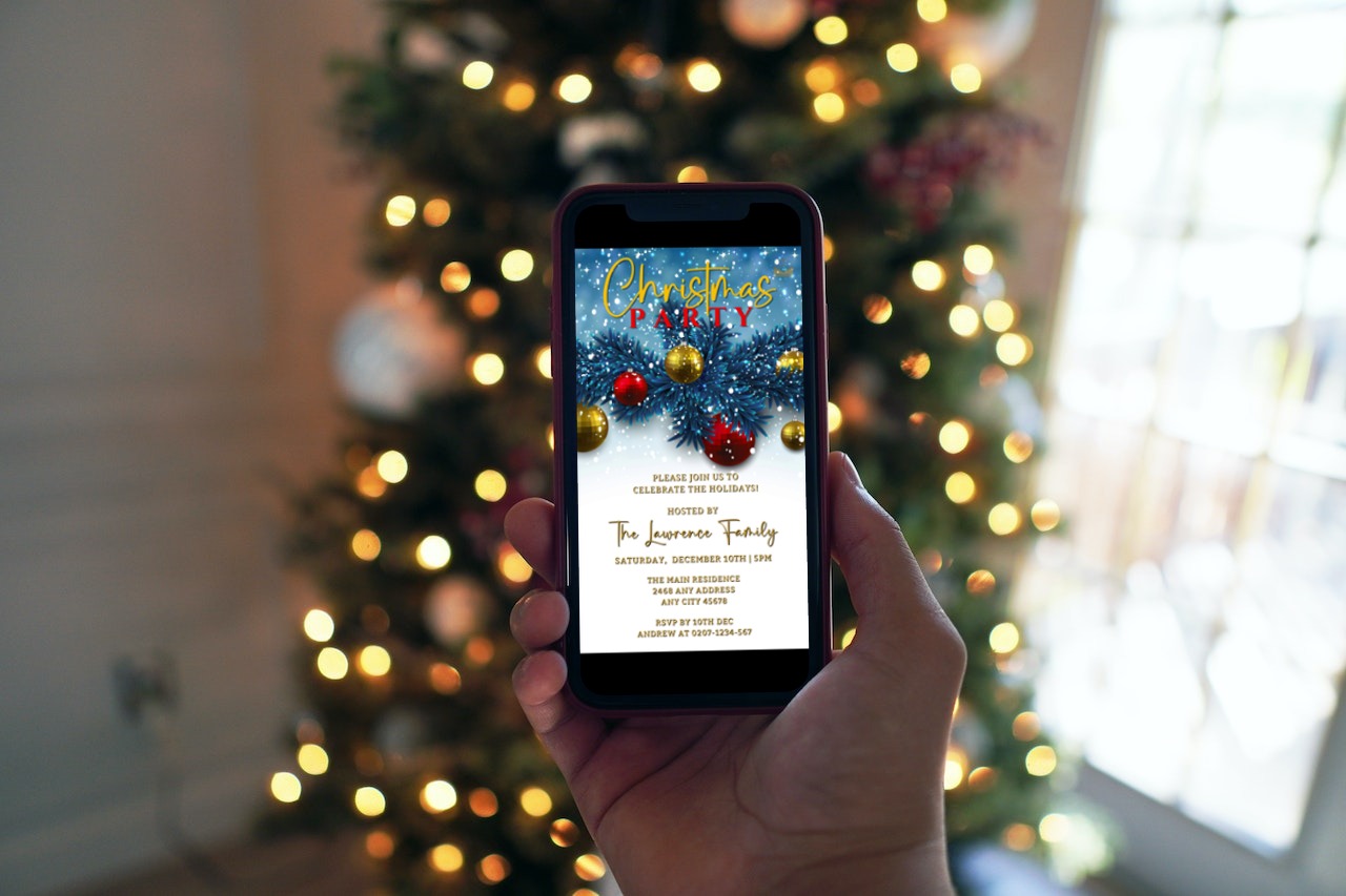 Hand holding a phone displaying the Snowy Elegance Blue Leaves Christmas Party Video Invite, a customizable digital invitation template editable via Canva.