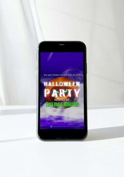 Smartphone displaying the Misty Purple Smoke Pumpkin Halloween Party Video Invite, featuring a pumpkin with green eyes and swirling purple smoke.