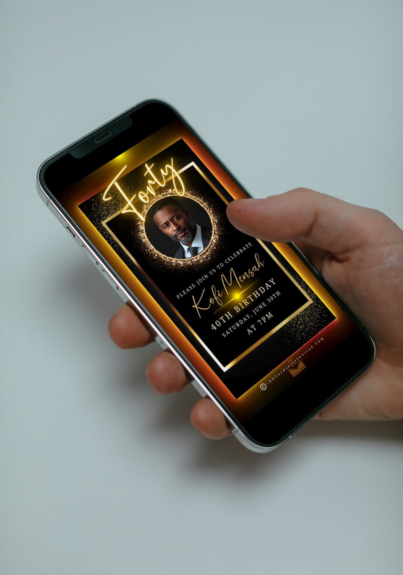 Hand holding a smartphone displaying an Elegant Animated Men’s 40th Birthday Video Invitation with an Oval Photo Frame, customizable via Canva.