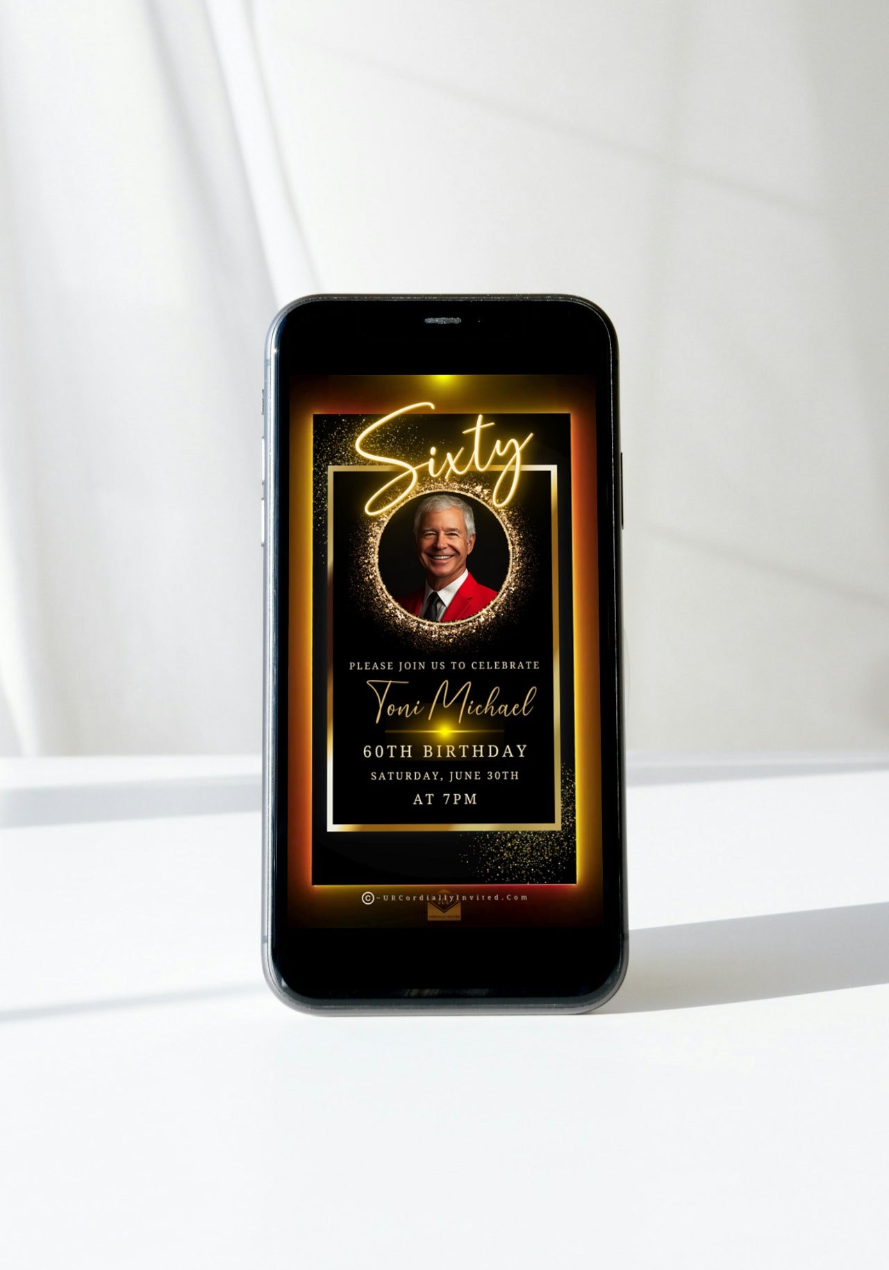 Cell phone displaying 50th Birthday Video Invitation with a photo of a man in a red suit in an elegant gold oval frame.