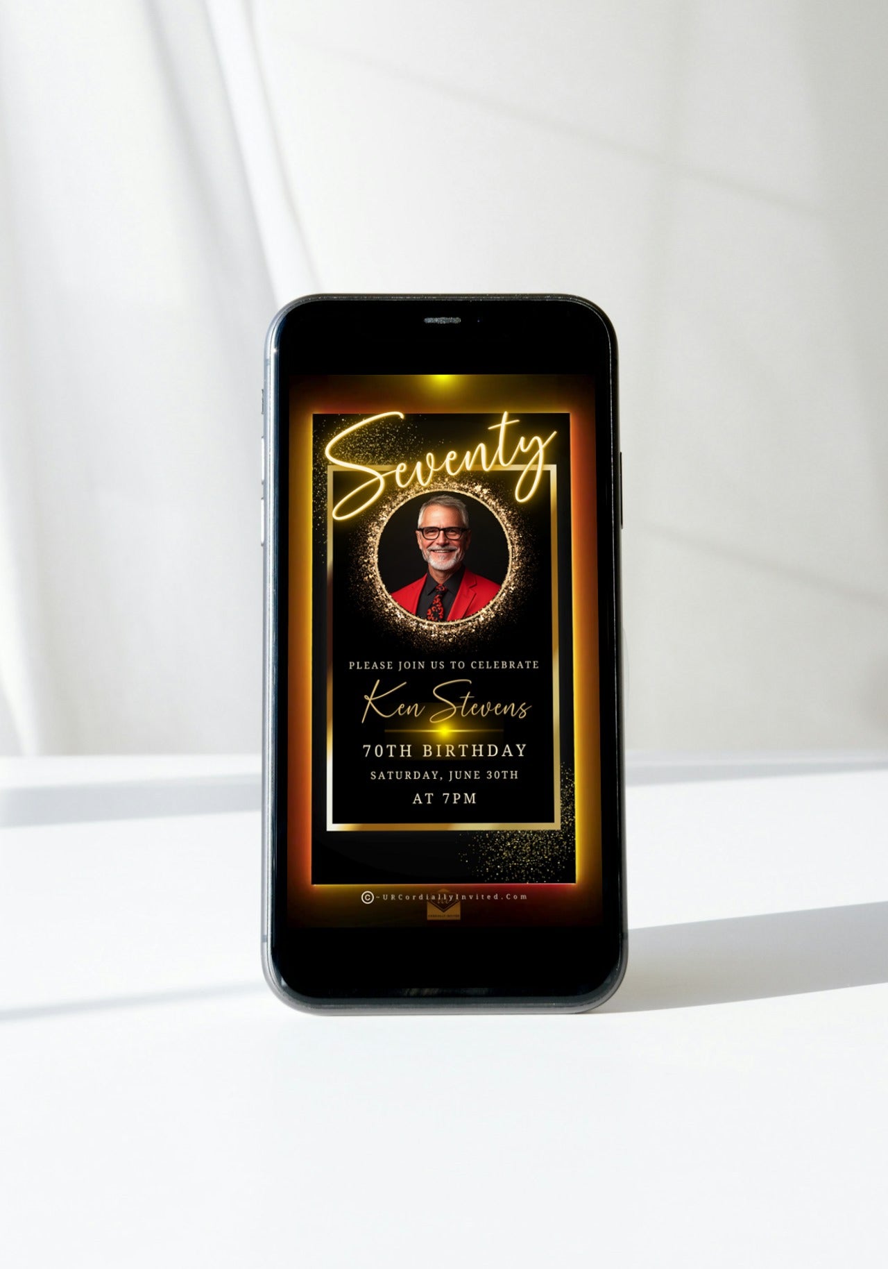 60th Birthday Video Invitation - Black & Gold Oval Photo Frame Animated Invite displayed on a smartphone screen showing a man smiling, perfect for elegant milestone celebrations.