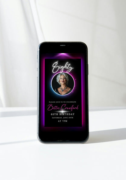 Pink & Purple 70th Birthday Video Invitation featuring a woman's photo framed by glowing oval neon, showcasing elegance for milestone celebrations.