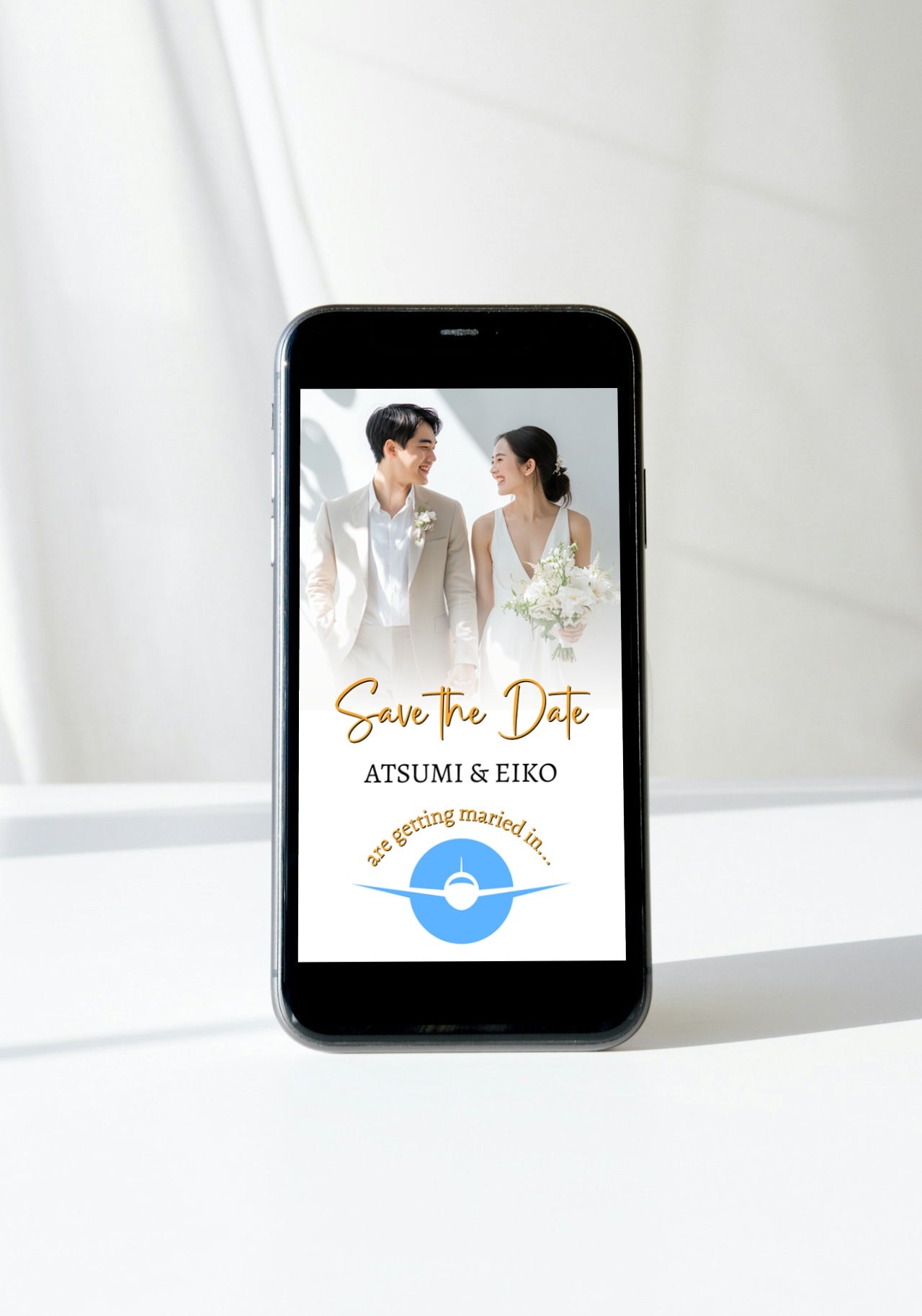 Smartphone displaying Tropical Destination Wedding Save the Date Video Invitation template featuring a couple in formal attire, designed for easy customization and sharing via digital platforms.