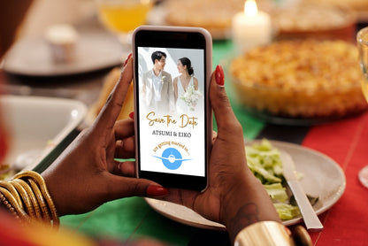 Person customizing a Tropical Destination Wedding Save the Date Video Invitation on a smartphone, showcasing eco-friendly digital design by URCordiallyInvited.