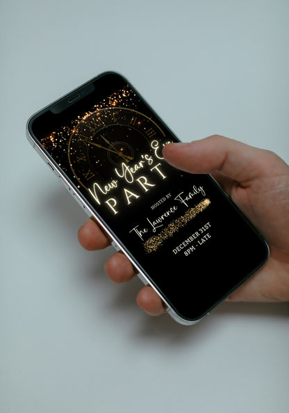 Hand holding a smartphone displaying Countdown Clock New Year’s Eve Party Animated Invitation, a customizable digital template from URCordiallyInvited.