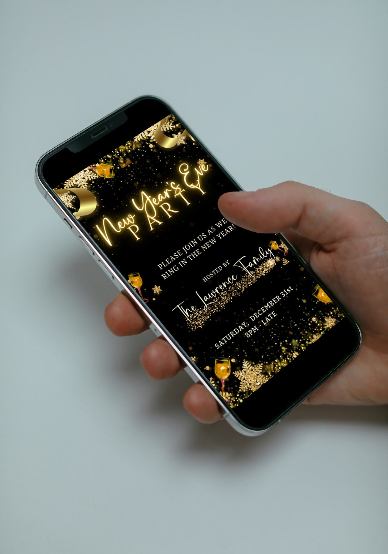 Hand holding a smartphone displaying the Champagne Theme Glitter New Year’s Eve Animated Party Invitation, showcasing customizable digital invitation features for festive celebrations.