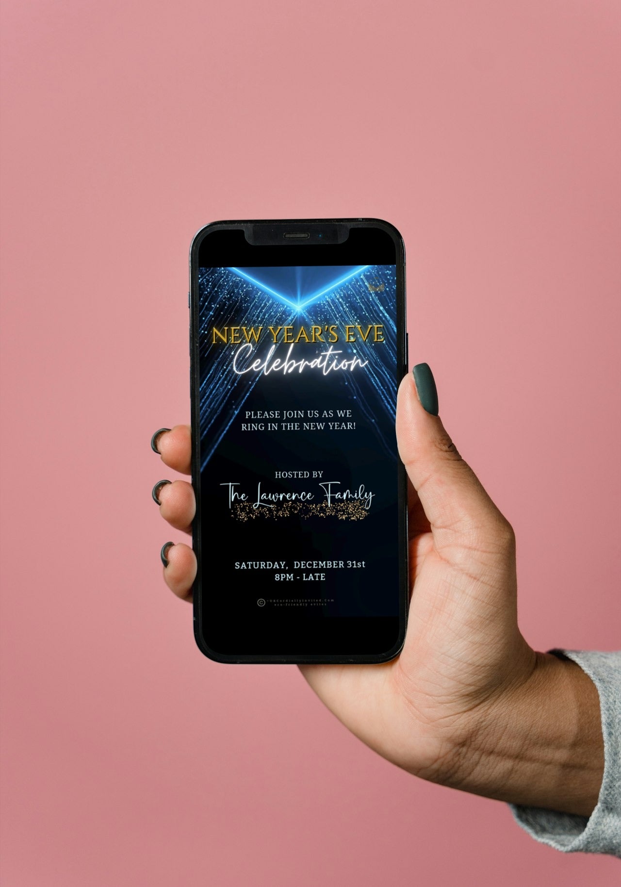 Hand holding a phone displaying the Dazzling Blue Gold New Year’s Eve Celebration Video Invitation template from URCordiallyInvited.