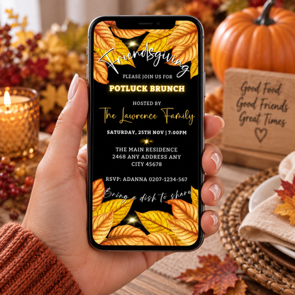 A hand holds a phone showing a Friendsgiving Potluck Brunch invite with fall leaves, pumpkins, and cozy fall decor.